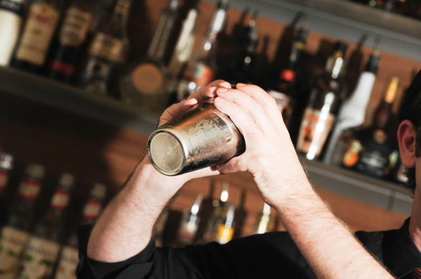 Someone Shaking a cocktail shaker